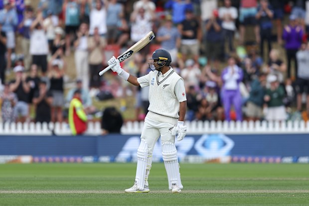 Rachin Ravindra celebrates his half-century during day three of the first Test between Australia and New Zealand.