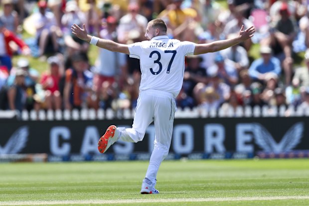 Gus Atkinson of England celebrates after taking the wicket of Tim Southee of New Zealand for a hat-trick during day two of the Second Test match in the series between New Zealand and England at Basin Reserve on December 07, 2024 in Wellington, New Zealand. (Photo by Hagen Hopkins/Getty Images)