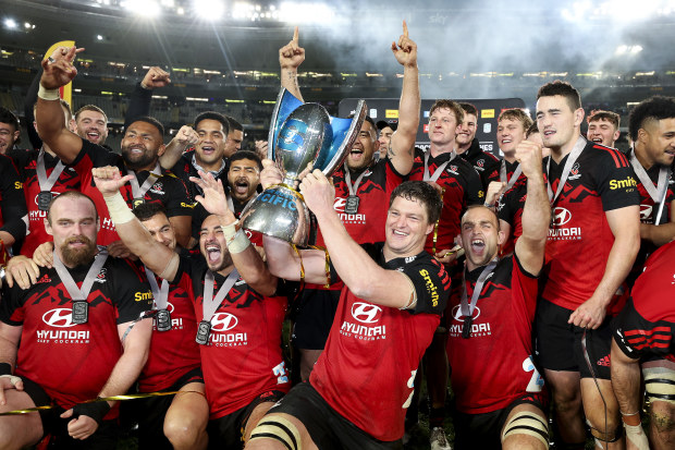 Scott Barrett of the Crusaders holds the Super Rugby Pacific trophy after winning the 2022 Super Rugby Pacific Final.
