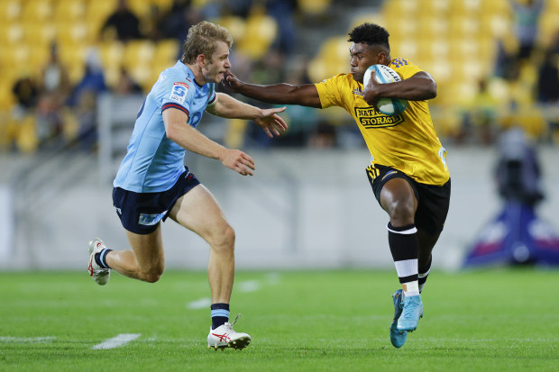 Kini Naholo fends off Max Jorgensen.