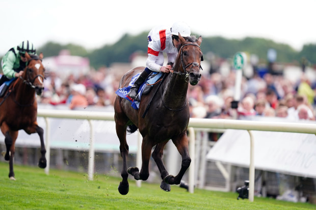 Deauville Legend ridden by Daniel Muscutt on their way to winning the Sky Bet Great Voltigeur Stakes at York Racecourse.