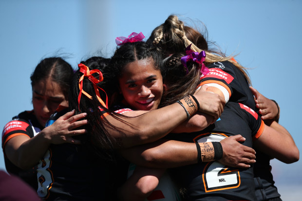 NEWCASTLE, AUSTRALIA - SEPTEMBER 09: Leianne Tufuga of the Wests Tigers celebrates a try scored by Jakiya Whitfeld of the Wests Tigers during the round eight NRLW match between Wests Tigers and Brisbane Broncos at McDonald Jones Stadium on September 09, 2023 in Newcastle, Australia. (Photo by Jason McCawley/Getty Images)