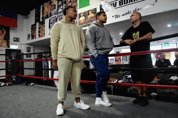 Tevita Pangai (centre) with his brother Jermaine Pangai  (left) with Anthony Mundine (right) at the Bondi Boxing Club in Waterloo.