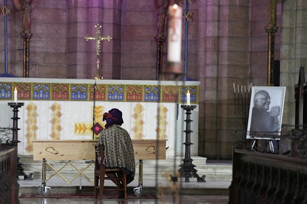 Mpho Tutu, sits with her fathers coffin Anglican Archbishop Emeritus Desmond Tutu  at the St. Georges Cathedral in Cape Town, South Africa, Saturday, Jan. 1, 2022.  