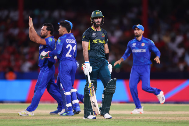 Glenn Maxwell of Australia looks dejected while leaving the field after being dismissed by Gulbadin Naib of Afghanistan (obscured) during the ICC Men's T20 Cricket World Cup West Indies & USA 2024 Super Eight match between Afghanistan and Australia at Arnos Vale Ground on June 22, 2024 in St Vincent, Saint Vincent and The Grenadines. (Photo by Darrian Traynor-ICC/ICC via Getty Images)
