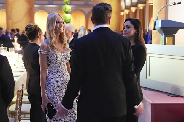 Elon Musk talks with Ivanka Trump and Shivon Zillis, right, before President-elect Donald Trump speaks at a dinner at the Building Museum, January 19, 2025, in Washington.