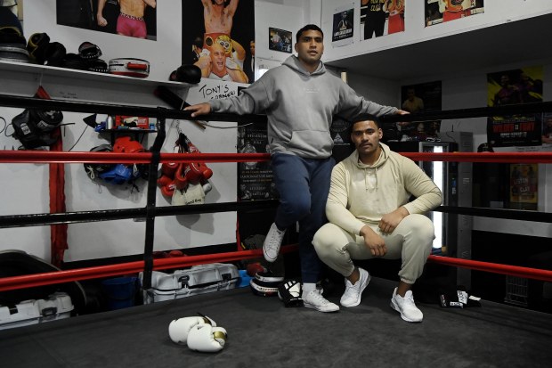 Tevita Pangai (left) with his brother Jermaine Pangai  (right) pose at the Bondi Boxing Club.