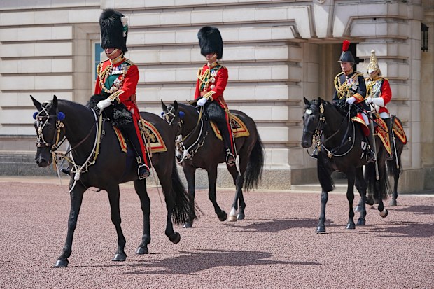 LONDON, ENGLAND - JUNE 02: Prince Charles, Prince of Wales (L), in his role as Colonel of the Welsh Guards, Prince William (C), Duke of Cambridge, in his role as Colonel of the Irish Guards, and Princess Anne (2R), Princess Royal, in her role as Colonel of the Blues and Royals, ride their horses along The Mall during Trooping The Colour on June 2, 2022 in London, England.Trooping The Colour, also known as The Queen's Birthday Parade, is a military ceremony performed by regiments of the British A