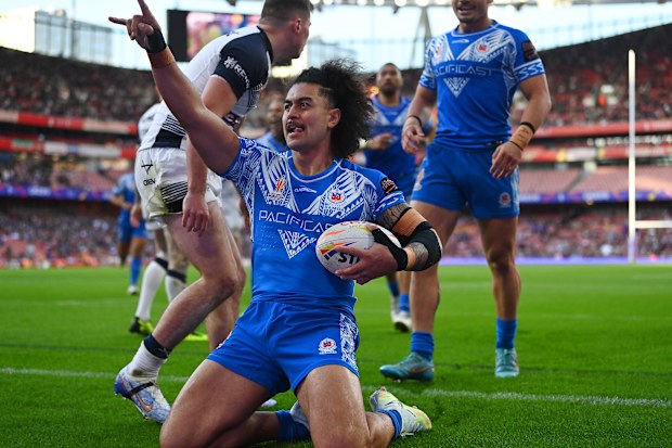 Tim Lafai of Samoa celebrates after scoring during the Rugby League World Cup. (Photo by Gareth Copley/Getty Images)