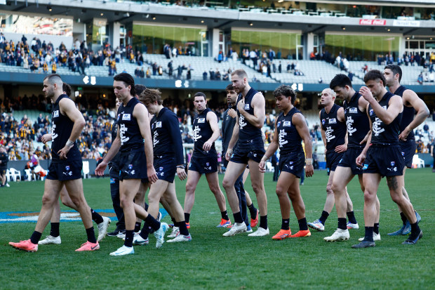 Carlton walk off after their round 22 loss to Hawthorn.