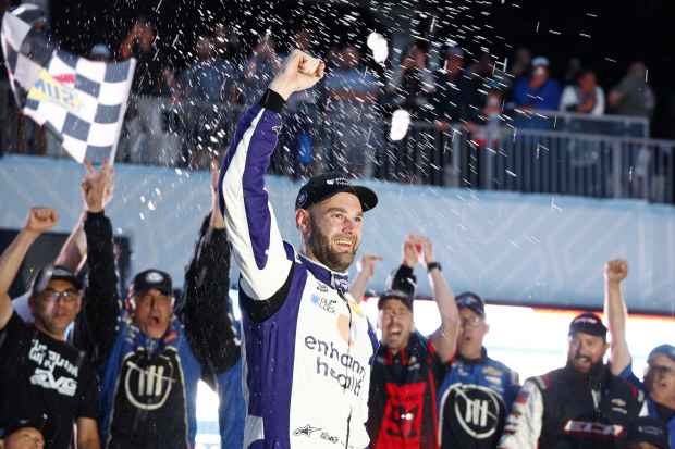NASCAR Cup Series driver Shane Van Gisbergen celebrates winning the Chicago Street Race.