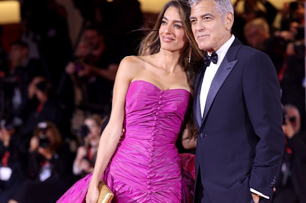 Amal Clooney and George Clooney at the Jay Kelly red carpet during the 82nd Venice International Film Festival on August 28, 2025 in Venice, Italy. 