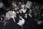 BUENOS AIRES, ARGENTINA - OCTOBER 17: A portrait of Liam Payne is seen placed on the sidewalk next to candles outside Casa Sur Hotel on October 17, 2024 in Buenos Aires, Argentina. According to the Buenos Aires police department, Payne fell from a third-floor hotel room balcony in Palermo, a famous neighborhood in Buenos Aires. Fans around the city gather to pay tribute to the former member of boy band One Direction. (Photo by Marcos Brindicci/Getty Images)