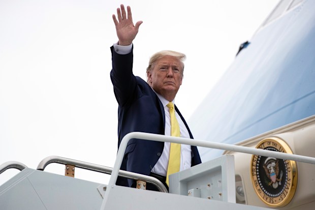 President Donald Trump waves as he boards Air Force One upon departure at the Orlando Sanford International Airport, Monday, March 9. Picture: Alex Brandon