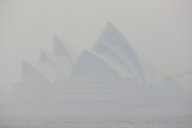 Thick smoke from wildfires shroud the Opera House in Sydney, Australia.