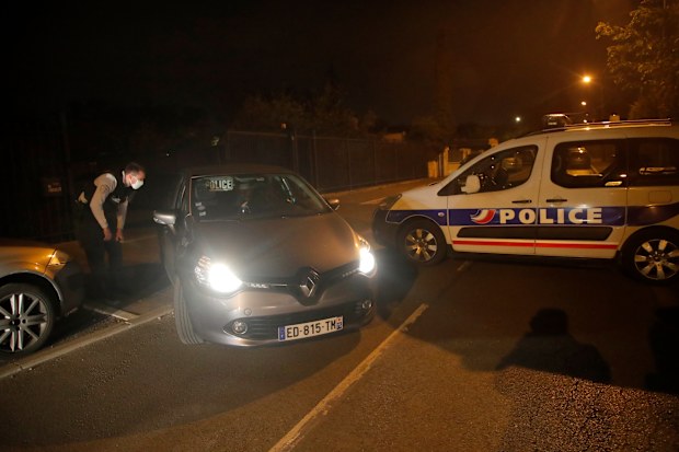 Police officers block the access after a history teacher who opened a discussion with students on caricatures of Islam's Prophet Muhammad was decapitated in a French street on Friday and police have shot the suspected killer dead, Friday, Oct. 16, 2020 in Conflans-Saint-Honorine, north of Paris. (AP Photo/Michel Euler)