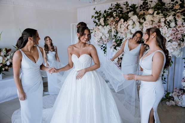 A bride with her bridesmaids on her wedding day.