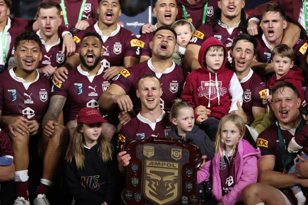 The Maroons celebrate with the State of Origin Shield after game three of the State of Origin series.