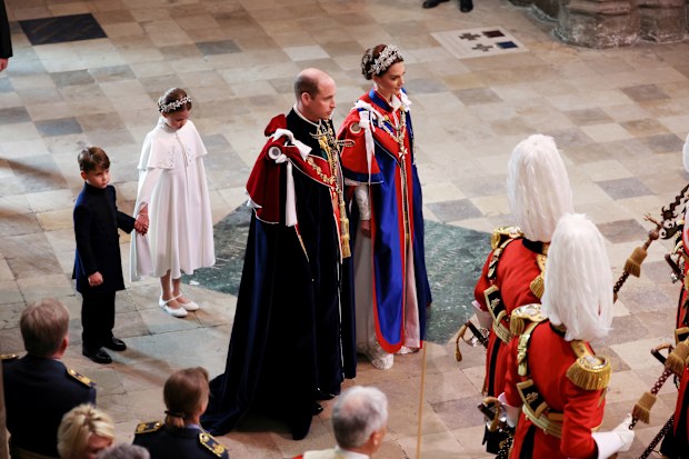 Catherine, Princess of Wales, Prince William, Prince of Wales, Princess Charlotte of Wales and Prince Louis of Wales during the Coronation of King Charles III and Queen Camilla on May 06, 2023 in London, England. 