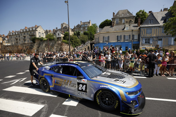 Fans gather around the NASCAR Garage 56 Chevrolet ZL1 ahead of the 100th anniversary of the 24 Hours of Le Mans.