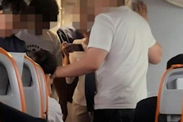 A 19-year-old Korean man tried to open a plane door mid-flight after complaining that he felt "pressure" on his chest, but luckily, the cabin crew stopped him.The passenger, who was on a red-eye flight from Cebu in the Philippines to Seoul, South Korea, was "acting strangely" about an hour into the flight, so he was moved to the front row of the plane close to the exit door where staff could monitor him, officials from Jeju Airlines said.