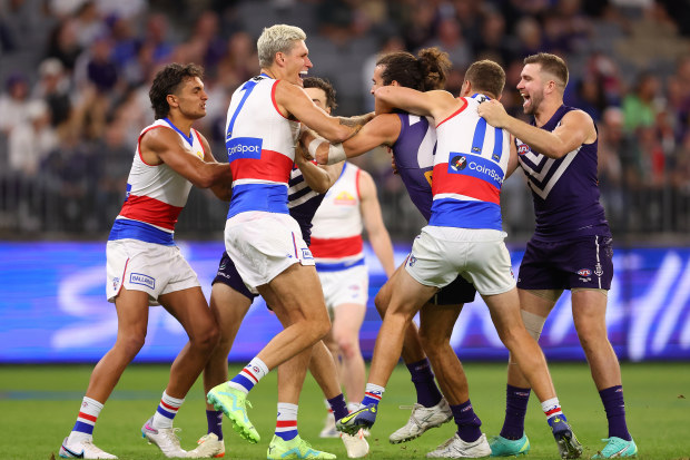 Alex Pearce of the Dockers and Rory Lobb of the Bulldogs wrestle before the first bounce during the round six AFL match between Fremantle Dockers and Western Bulldogs at Optus Stadium, on April 21, 2023, in Perth, Australia. (Photo by Paul Kane/Getty Images)