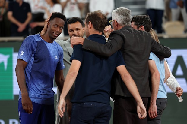 PARIS, FRANCE - MAY 25: Gael Monls of France interacts with French former players Gilles Simon, Jo-Wilfried Tsonga and Richard Gasquet and Amelie Mauresmo - Tournament Director, and Gilles Moretton - President of the French Tennis Federation following defeat against Hugo Gaston of France in their Men's Singles first round match on Day Two of the 2026 French Open at Roland Garros on May 25, 2026 in Paris, France. (Photo by Dan Istitene/Getty Images)