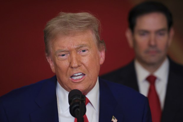 President Donald Trump speaks from the East Room of the White House in Washington, Saturday, June 21, 2025, after the U.S. military struck three Iranian nuclear and military sites, directly joining Israel's effort to decapitate the country's nuclear program, as Secretary of State Marco Rubio listens. (Carlos Barria/Pool via AP)