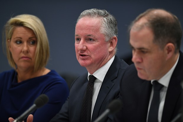 Nine Entertainment CEO Hugh Marks (centre) speaks during a Parliamentary Joint Committee on Intelligence and Security Freedom of the Press inquiry in Sydney, Tuesday, August, 13, 2019. 