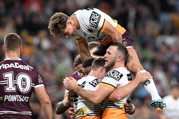 Billy Walters of the Broncos celebrates with team mates after scoring a try during the round 10 NRL match between Manly Sea Eagles and Brisbane Broncos at Suncorp Stadium on May 05, 2023 in Brisbane, Australia. (Photo by Bradley Kanaris/Getty Images)