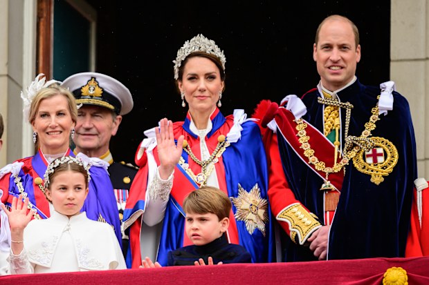 Catherine, Princess of Wales, waves from the balcony of Buckingham Palace with Prince William, Prince of Wales and Princess Charlotte and Prince Louis during the Coronation of King Charles III and Queen Camilla on May 06, 2023