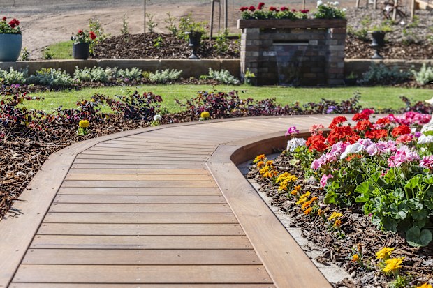 front yard garden with path and flower beds