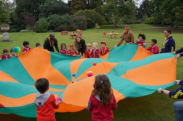 WINDSOR, ENGLAND - SEPTEMBER 18: Catherine, Princess of Wales (L) and First Lady Melania Trump play a game with children as they meet members of the Scouts' Squirrels programme in Frogmore Gardens during the State visit by the President of the United States of America and U.S. First Lady Melania Trump, on September 18, 2025 in Windsor, England. (Photo by Yui Mok - WPA Pool/Getty Images)
