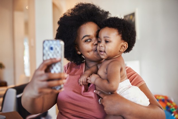 Cropped shot of a young woman taking a selfie with her baby girl
