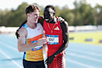 Lachlan Kennedy (left) and Gout Gout embrace as the latter celebrates winning the 200m title at the 2025 Australian athletics championships. Kennedy was disqualified for a false start.