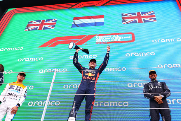 Lando Norris (left) on the podium with winner Max Verstappen (centre) and Lewis Hamilton (right).