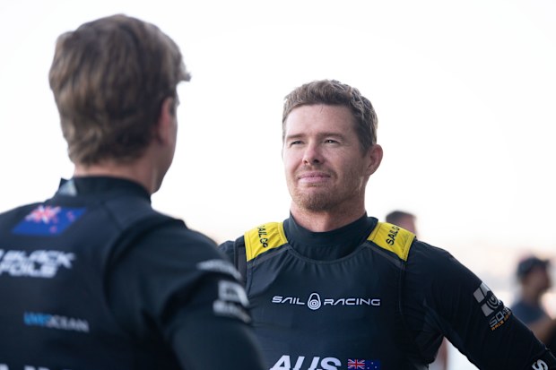 SYDNEY, AUSTRALIA - FEBRUARY 07: Tom Slingsby of Team Australia interacts with Peter Burling of Team New Zealand during a team photo media opportunity at Mrs Macquarie's Chair ahead of SailGP Sydney on February 07, 2025 in Sydney, Australia. (Photo by Wendell Teodoro/Getty Images)
