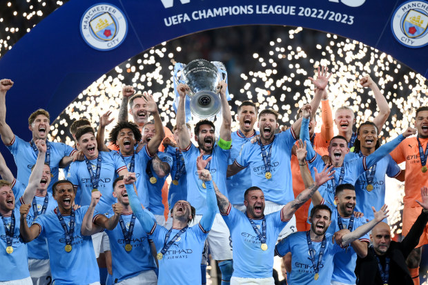 Manchester City lifts the Champions League trophy.