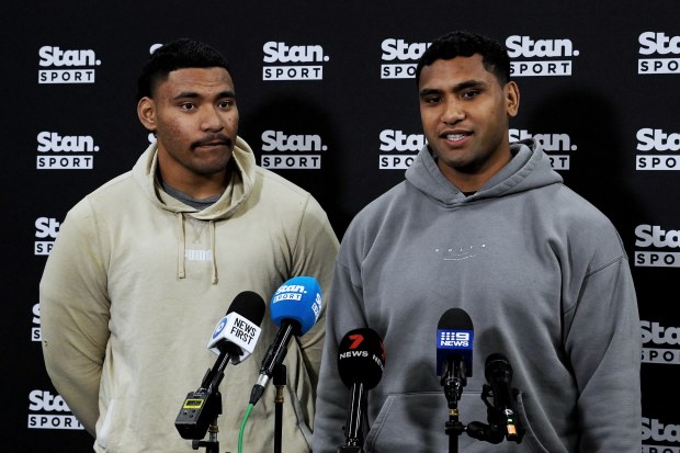 Tevita Pangai Junior (right) with his younger brother Jermaine Pangai (left) speaking at a press conference.