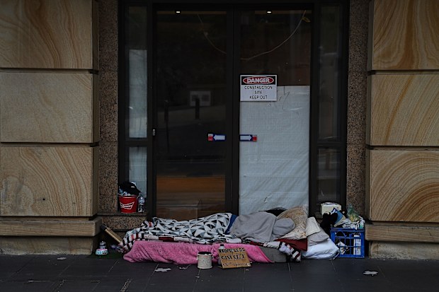A homeless person sleeps in Sydney's CBD.