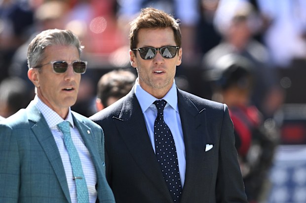 Broadcasters Kevin Burkhardt and Tom Brady before the game at Cleveland Browns Stadium.