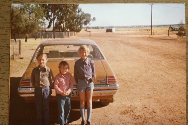Ray grew up on a rural farm with his two brothers.