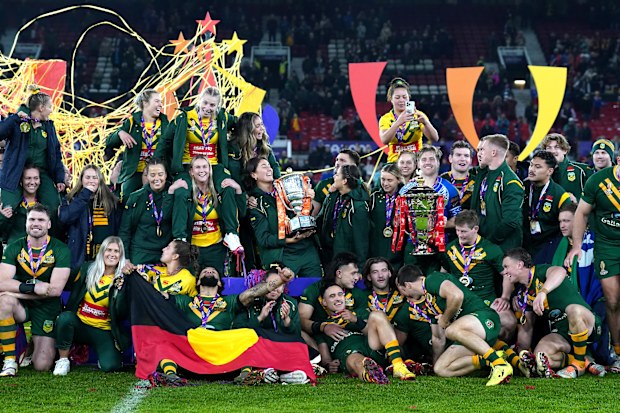 The Australia men and women teams celebrate following their victories in the Rugby League World Cup final and Women's Rugby League World Cup Final respectively at Old Trafford, Manchester. Picture date: Saturday November 19, 2022. (Photo by Tim Goode/PA Images via Getty Images)