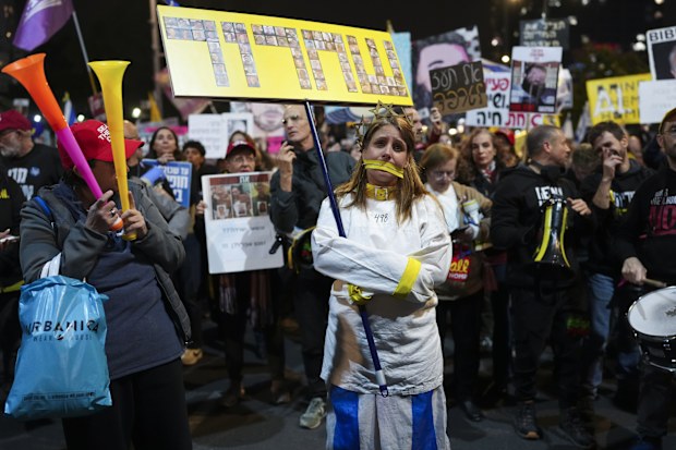 Protesters demanding the immediate release of hostages held by Hamas in the Gaza Strip, in Tel Aviv, Israel, Saturday, Feb. 15, 2025. (AP Photo/Ohad Zwigenberg)