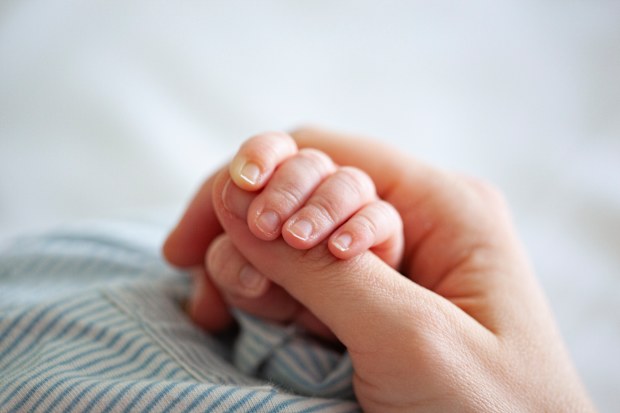 A first-time mum who went into premature labour while quarantining in Brisbane has been returned to hotel quarantine shortly after giving birth, separated from her baby.