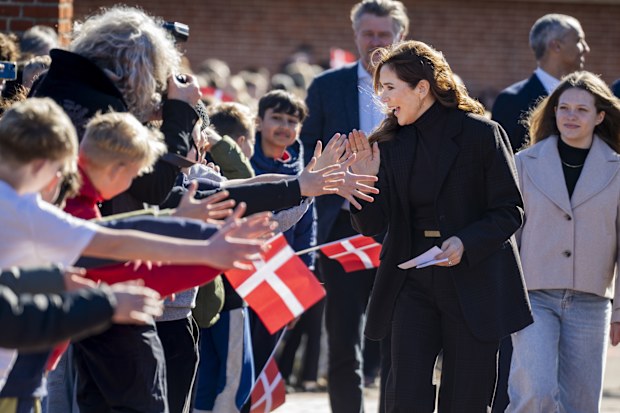 VALLENSBAEK, DENMARK - MARCH 17:  Queen Mary of Denmark is welcomed by students at Pilehaveskolen as she participates in the School Force during a visit on March 17, 2025 in Vallensbaek, Denmark. (Photo by Martin Sylvest Andersen/Getty Images)