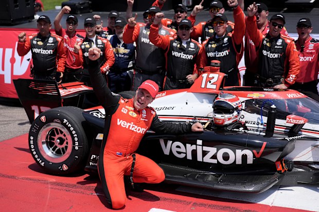 Will Power celebrates with his crew after winning at Iowa Speedway.