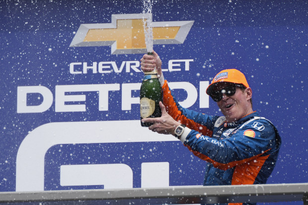 Scott Dixon celebrates after winning the IndyCar Detroit Grand Prix auto race in Detroit, Sunday, June 2, 2024. (AP Photo/Paul Sancya)