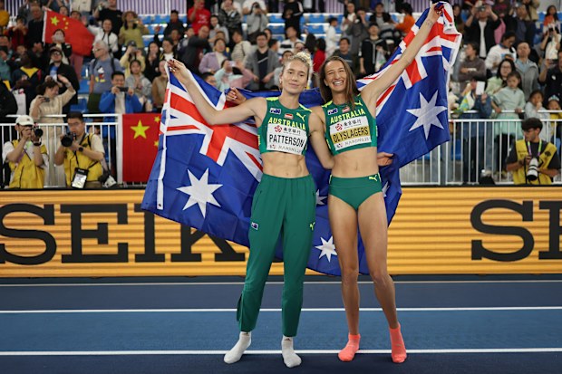 Silver medallist Eleanor Patterson (left) and gold medallist Nicola Olyslagers celebrate at the world athletics indoor championships.
