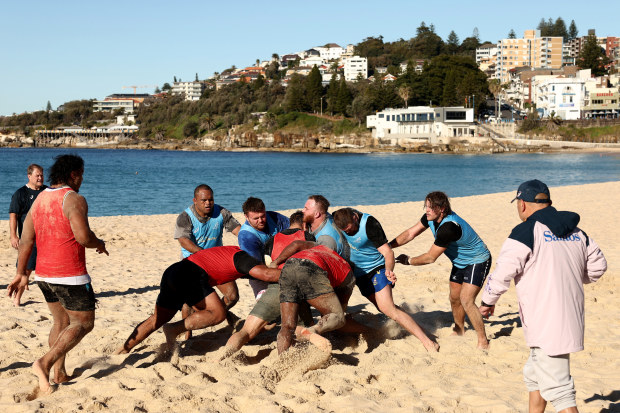 Wallabies players take part in a maul drill at Coogee Beach.